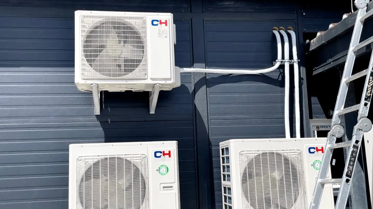 Farmyard of the TAS-BIO facility with a grain elevator and outdoor HVAC units.