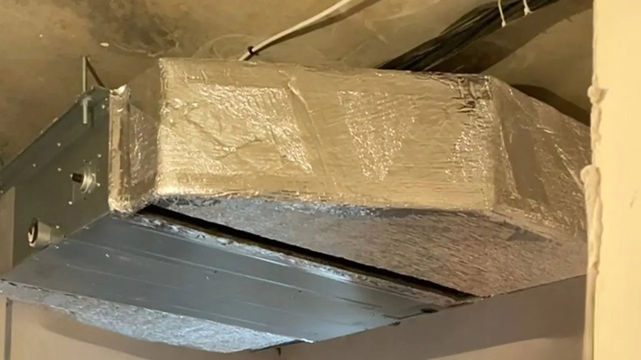 Insulated ventilation module installed in the apartment ceiling void.