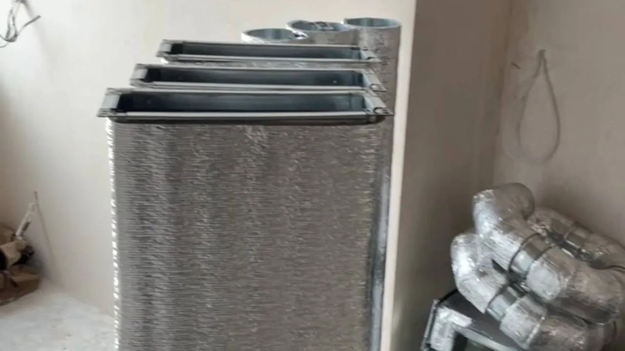 Heat-recovery unit and duct set in the apartment's technical zone before final connection.