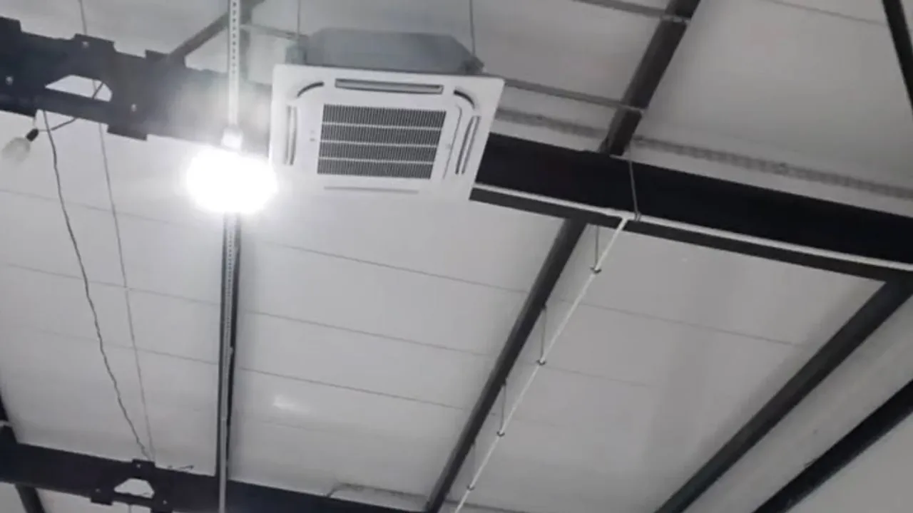 Row of Cooper&Hunter outdoor units installed by Ventall on steel stands along the building facade.